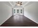 Spacious living room with coffered ceilings, a ceiling fan, and multiple windows at 4335 Northwind Dr, Ellenwood, GA 30294