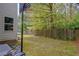 Fenced backyard with well-maintained lawn and a basketball hoop for outdoor activities at 2951 Edgewater St, South Fulton, GA 30331