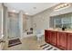 Bright bathroom featuring walk-in shower, soaking tub, modern vanity, and plenty of natural light at 2951 Edgewater St, South Fulton, GA 30331