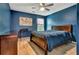 Blue bedroom featuring a large bed and closet at 2951 Edgewater St, South Fulton, GA 30331