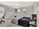 Bright bedroom featuring a large bed and desk at 2951 Edgewater St, South Fulton, GA 30331