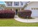 Close-up of a charming front entrance with manicured bushes and a walkway to the front door at 2951 Edgewater St, South Fulton, GA 30331