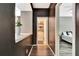 View of hallway featuring dark brown walls and decorative shelving leading to the bathroom and bedroom at 2951 Edgewater St, South Fulton, GA 30331