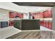 Open kitchen with island, breakfast bar, cherry cabinets, and stainless steel appliances at 2951 Edgewater St, South Fulton, GA 30331
