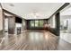 Inviting living room with a fireplace, hardwood floors, and large windows at 2951 Edgewater St, South Fulton, GA 30331
