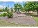Neighborhood playground with slides and benches for to play on, surrounded by green grass at 2951 Edgewater St, South Fulton, GA 30331