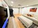 Finished basement featuring a large sofa, entertainment setup, and exercise equipment at 3205 Brandywine Nw Pl, Marietta, GA 30064