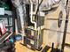 Basement featuring furnace, weight training machine, and exposed ductwork at 3205 Brandywine Nw Pl, Marietta, GA 30064
