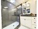 Stylish bathroom features glass shower, herringbone tiling, double sink vanity and modern finishes at 3205 Brandywine Nw Pl, Marietta, GA 30064