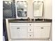 Bathroom with double sinks, black hardware, and walk in shower at 3205 Brandywine Nw Pl, Marietta, GA 30064