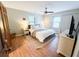 Bedroom with two windows, a ceiling fan, hardwood floors, and neutral colored walls at 3205 Brandywine Nw Pl, Marietta, GA 30064