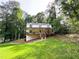Charming two-story home with a spacious front porch and well-manicured lawn at 3205 Brandywine Nw Pl, Marietta, GA 30064