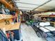 Garage with a golf cart, storage shelves, tools, and other equipment at 3205 Brandywine Nw Pl, Marietta, GA 30064