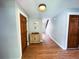 Hallway with wood look floors, light blue walls, wooden doors and a cabinet near the wall at 3205 Brandywine Nw Pl, Marietta, GA 30064