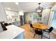 A well-lit kitchen featuring stainless steel appliances, modern countertops, and dining table with chairs at 3205 Brandywine Nw Pl, Marietta, GA 30064