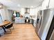Modern kitchen with stainless steel appliances, shaker cabinets, and eat-in table at 3205 Brandywine Nw Pl, Marietta, GA 30064