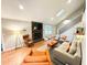 Bright living room features hardwood floors, a brick fireplace, vaulted ceiling, and an abundance of natural light at 3205 Brandywine Nw Pl, Marietta, GA 30064