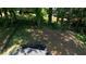 Large backyard view from the roof with mature trees and a small deck at 3959 Wood Path Dr, Stone Mountain, GA 30083