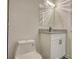 Clean bathroom featuring a modern vanity, mirror, and toilet at 3959 Wood Path Dr, Stone Mountain, GA 30083
