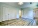 Bright bedroom featuring new wood flooring and an ensuite bathroom at 3959 Wood Path Dr, Stone Mountain, GA 30083