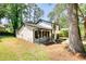 Well-maintained two-story home featuring a welcoming front porch and lush green lawn at 3959 Wood Path Dr, Stone Mountain, GA 30083