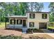 Charming two-story home with a covered front porch and a built-in garage at 3959 Wood Path Dr, Stone Mountain, GA 30083