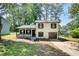 Charming two-story home featuring a covered front porch and a built-in garage at 3959 Wood Path Dr, Stone Mountain, GA 30083