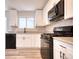 Modern kitchen with stainless steel appliances, white cabinetry and modern backsplash at 3959 Wood Path Dr, Stone Mountain, GA 30083