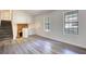 Bright living room featuring modern flooring, fresh paint, and stone fireplace at 3959 Wood Path Dr, Stone Mountain, GA 30083