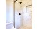 Modern tiled shower featuring bronze fixtures and tile flooring at 3959 Wood Path Dr, Stone Mountain, GA 30083