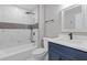 Stylish bathroom featuring shower-tub combo with marble-look tile and vanity at 798 Brownlee Ln, Lawrenceville, GA 30044