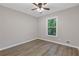 Cozy bedroom with wood-look floors, neutral walls, and plenty of natural light at 798 Brownlee Ln, Lawrenceville, GA 30044