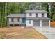 Charming two-story home featuring an attached two-car garage and a welcoming front porch at 798 Brownlee Ln, Lawrenceville, GA 30044