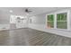 Spacious living room with wood-look floors, neutral walls, and view to backyard at 798 Brownlee Ln, Lawrenceville, GA 30044
