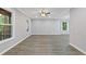 Spacious living room with gray walls, white trim, luxury vinyl flooring, and lots of natural light at 798 Brownlee Ln, Lawrenceville, GA 30044