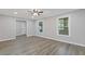 Bright and airy living area featuring vinyl floors, neutral gray paint, and an abundance of natural light at 798 Brownlee Ln, Lawrenceville, GA 30044