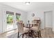 Cozy dining area with natural light, a glass table, and access to the outdoor deck at 2425 Clifton Springs Rd, Decatur, GA 30034