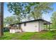 Beautifully painted brick home with a wooden deck and porch nestled within a vibrant green landscape at 2425 Clifton Springs Rd, Decatur, GA 30034