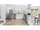 Modern kitchen featuring white cabinets, granite countertops, and stainless steel appliances at 2425 Clifton Springs Rd, Decatur, GA 30034