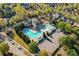 An aerial view of neighborhood community pools, showcasing a resort-style amenity with ample parking at 3213 Blackley Old Rd, Douglasville, GA 30135