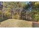 Backyard with lawn and surrounding trees at 3213 Blackley Old Rd, Douglasville, GA 30135