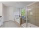 Bright and airy bathroom with a walk-in shower, separate tub, and great natural light at 3213 Blackley Old Rd, Douglasville, GA 30135