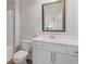 Well-maintained bathroom with a single vanity and framed mirror at 3213 Blackley Old Rd, Douglasville, GA 30135