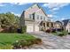 Beautiful two-story home with a two-car garage, well-maintained lawn, and inviting curb appeal at 3213 Blackley Old Rd, Douglasville, GA 30135