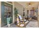 Inviting front porch with rocking chairs, ceiling fans, and relaxing decor creating a cozy outdoor space at 3213 Blackley Old Rd, Douglasville, GA 30135