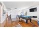Game room with a pool table, television, and wood floors at 3213 Blackley Old Rd, Douglasville, GA 30135