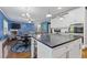 Open-concept kitchen with a large island, granite countertops, and seamless flow to the living area at 3213 Blackley Old Rd, Douglasville, GA 30135