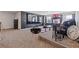 Spacious living room with a large screen tv, a popcorn machine, and plenty of seating at 3213 Blackley Old Rd, Douglasville, GA 30135