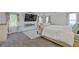 The primary bedroom has soft carpeting, large windows, and modern decor throughout at 3213 Blackley Old Rd, Douglasville, GA 30135