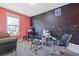 Office with pink and black walls, glass desk, and brown carpet at 3213 Blackley Old Rd, Douglasville, GA 30135